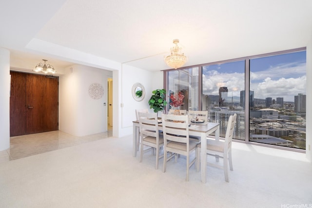 425 S St Unit 2401, Honolulu, HI 96813 - dining room featuring a chandelier, floor to ceiling windows, and carpet