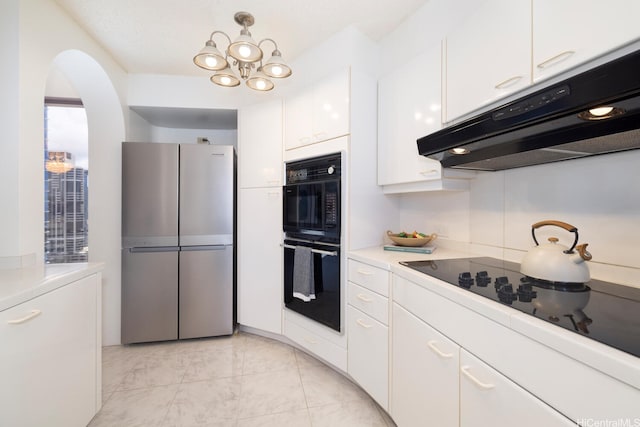 425 S St Unit 2401, Honolulu, HI 96813 - kitchen with black appliances, under cabinet range hood, white cabinetry, and light countertops