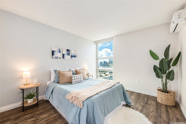 801 S St Unit 3822, Honolulu, HI 96813 - bedroom with wood finished floors, a wall mounted air conditioner, and a textured ceiling