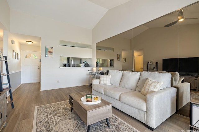 92-1151 Palahia St Unit B204, Kapolei, HI 96707 - living room featuring ceiling fan, wood finished floors, and high vaulted ceiling
