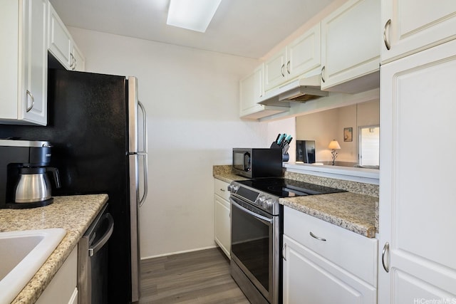 92-1151 Palahia St Unit B204, Kapolei, HI 96707 - kitchen with appliances with stainless steel finishes, under cabinet range hood, dark wood-type flooring, white cabinetry, and light countertops