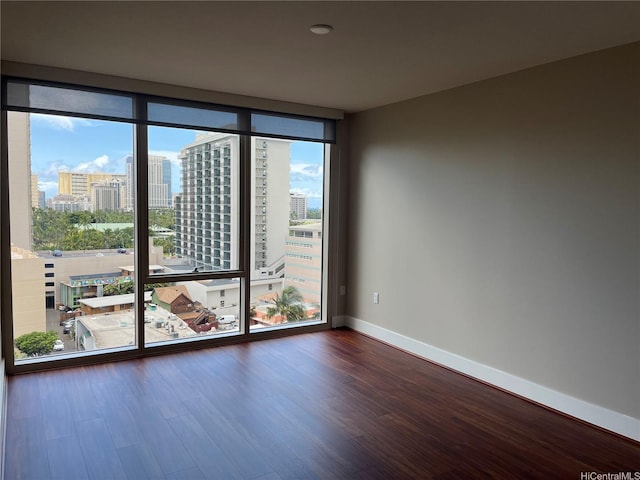 1837 Kalakaua Ave Unit 1103, Honolulu, HI 96815 - spare room with wood finished floors and a city view