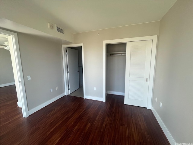 1837 Kalakaua Ave Unit 1103, Honolulu, HI 96815 - unfurnished bedroom with dark wood-type flooring and a closet