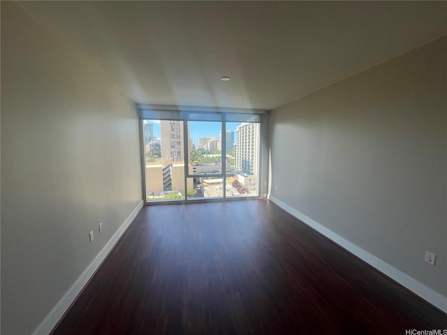 1837 Kalakaua Ave Unit 1103, Honolulu, HI 96815 - unfurnished room with dark wood finished floors and a city view