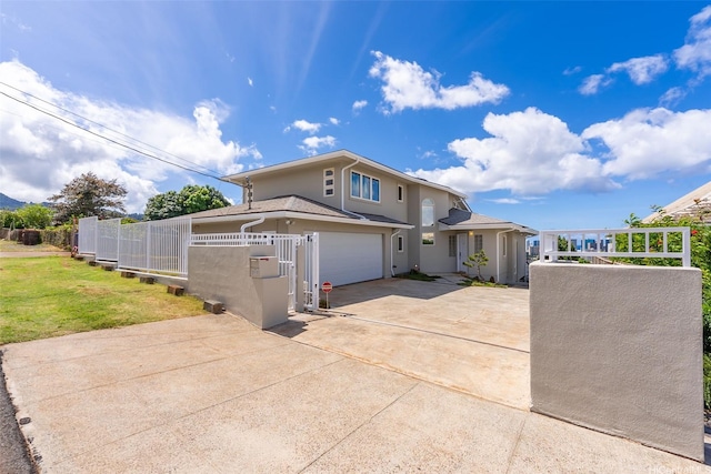 2117 Aulii St, Honolulu, HI 96817 - view of front facade featuring stucco siding, a garage, and driveway