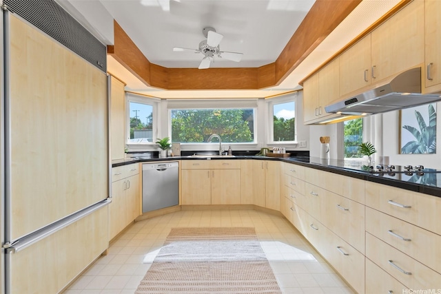 2117 Aulii St, Honolulu, HI 96817 - kitchen with paneled built in fridge, light brown cabinetry, dishwasher, under cabinet range hood, and a ceiling fan