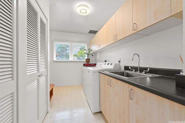 2117 Aulii St, Honolulu, HI 96817 - laundry room with washing machine and dryer, cabinet space, and light tile patterned floors