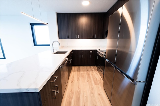 615 Keawe St Unit 3207, Honolulu, HI 96813 - kitchen with stainless steel appliances, light wood finished floors, modern cabinets, and light stone countertops