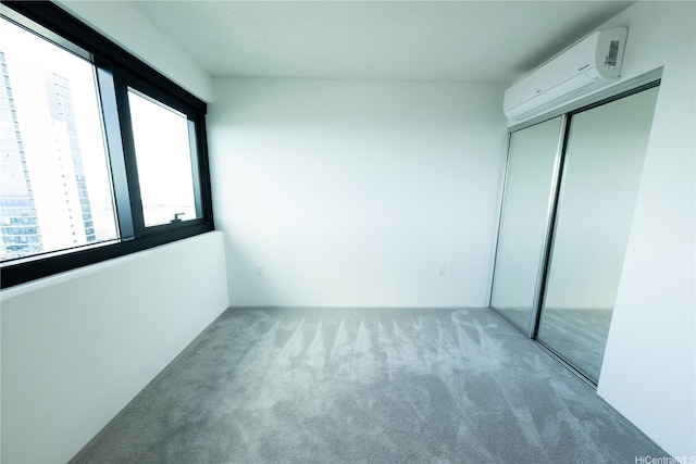 615 Keawe St Unit 3207, Honolulu, HI 96813 - unfurnished bedroom featuring carpet, a wall unit AC, and a closet