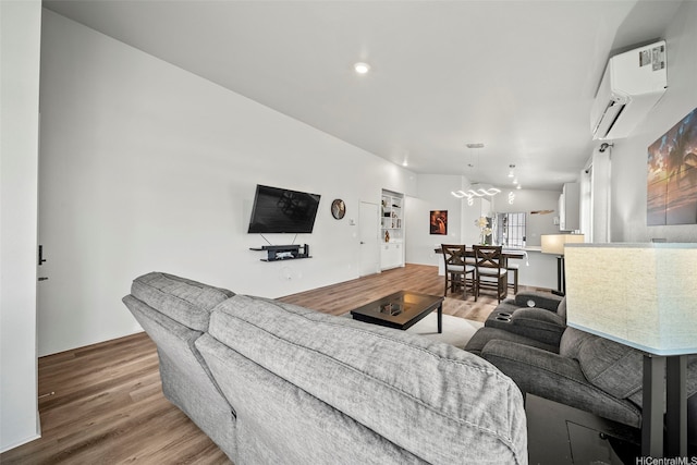 91-1775 Kohanahana Loop, Ewa Beach, HI 96706 - living area with wood finished floors, a wall unit AC, a chandelier, and recessed lighting