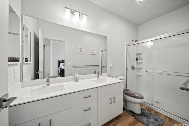 91-1775 Kohanahana Loop, Ewa Beach, HI 96706 - full bathroom with double vanity, a shower stall, and wood finished floors