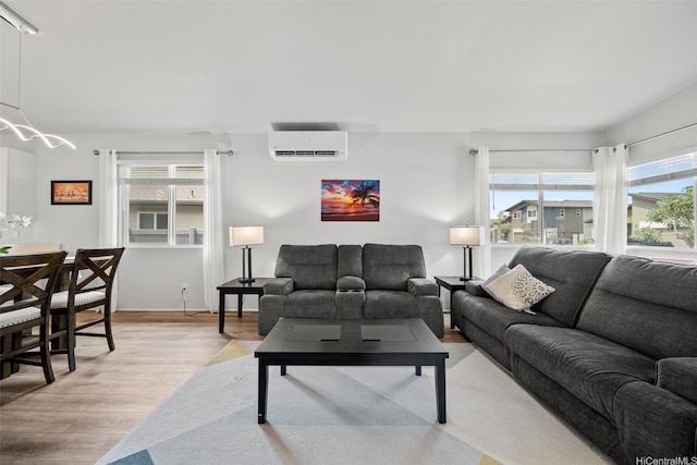 91-1775 Kohanahana Loop, Ewa Beach, HI 96706 - living area with an AC wall unit, light wood-type flooring, and healthy amount of natural light