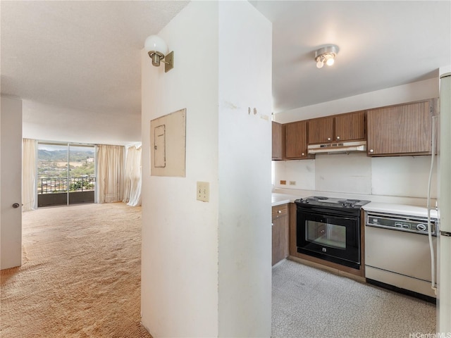 1160 Ala Napunani St Unit 1407, Honolulu, HI 96818 - kitchen featuring dishwasher, under cabinet range hood, black range with electric cooktop, light countertops, and brown cabinets