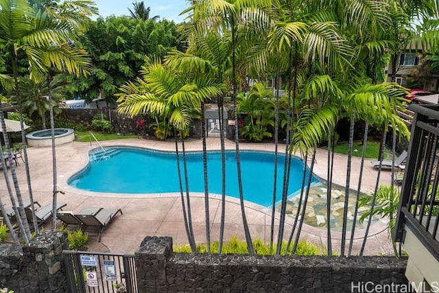 75-6025 Alii Dr Unit L201, Kailua Kona, HI 96740 - community pool featuring a patio and a gate