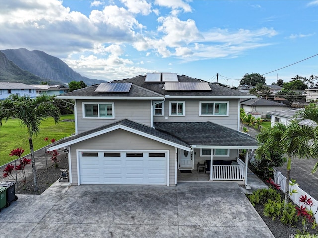 45-521 Halekou Rd Unit B, Kaneohe, HI 96744 - view of front of property featuring covered porch, a garage, driveway, solar panels, and a mountain view