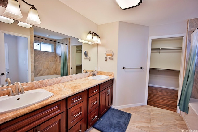 45-521 Halekou Rd Unit B, Kaneohe, HI 96744 - bathroom with double vanity, shower / bath combo, a walk in closet, and tile patterned floors
