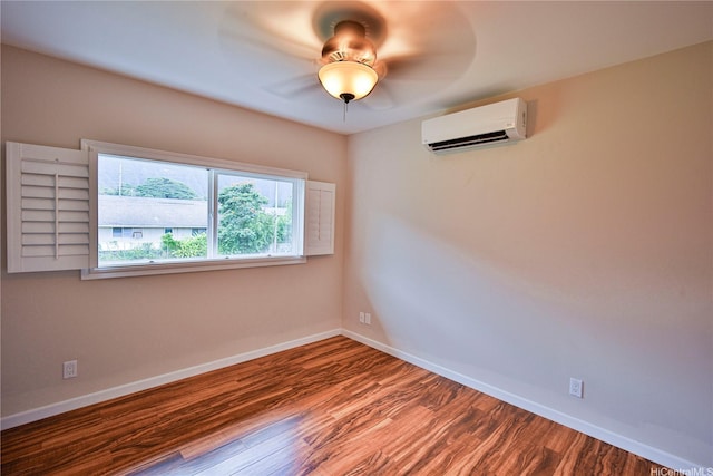 45-521 Halekou Rd Unit B, Kaneohe, HI 96744 - unfurnished room with a wall unit AC, wood finished floors, and ceiling fan