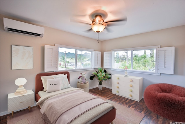 45-521 Halekou Rd Unit B, Kaneohe, HI 96744 - bedroom with an AC wall unit, wood finished floors, and a ceiling fan