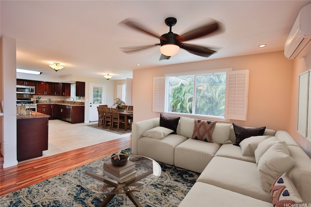 45-521 Halekou Rd Unit B, Kaneohe, HI 96744 - living area featuring a wall mounted AC, plenty of natural light, light wood finished floors, a ceiling fan, and recessed lighting