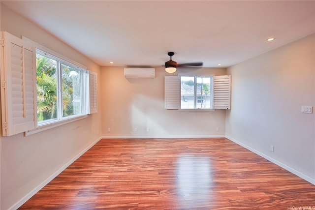 45-521 Halekou Rd Unit B, Kaneohe, HI 96744 - empty room featuring an AC wall unit, wood finished floors, ceiling fan, and recessed lighting