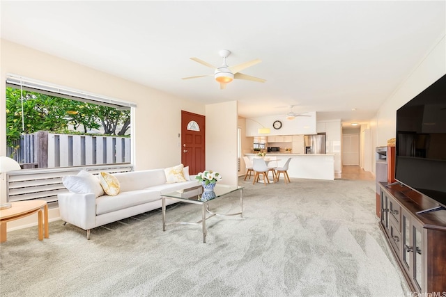 341 Opihikao Pl Unit 422, Honolulu, HI 96825 - living area featuring ceiling fan and light carpet