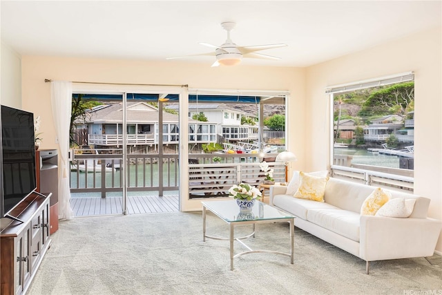 341 Opihikao Pl Unit 422, Honolulu, HI 96825 - carpeted living room featuring a water view and a ceiling fan
