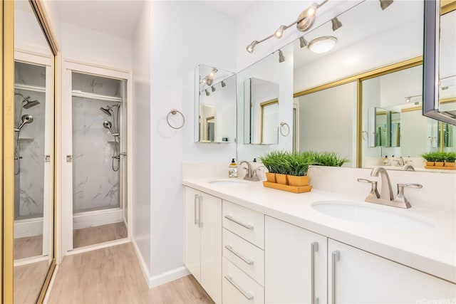 341 Opihikao Pl Unit 422, Honolulu, HI 96825 - full bathroom featuring wood finished floors, double vanity, and a marble finish shower