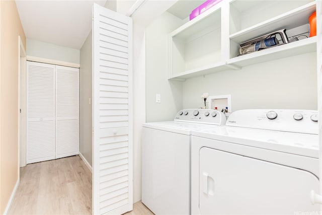 341 Opihikao Pl Unit 422, Honolulu, HI 96825 - laundry room featuring separate washer and dryer and light wood-style flooring