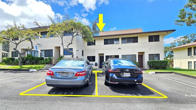 98-441 Kaonohi St Unit 35-3, Aiea, HI 96701 - view of front of home featuring uncovered parking and stucco siding