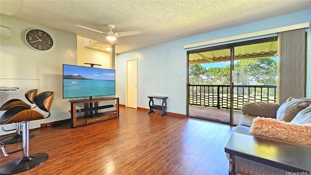 98-441 Kaonohi St Unit 35-3, Aiea, HI 96701 - living area featuring wood finished floors, a ceiling fan, and a textured ceiling