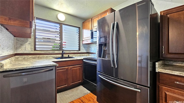 98-441 Kaonohi St Unit 35-3, Aiea, HI 96701 - kitchen featuring appliances with stainless steel finishes, wood finished floors, light countertops, and a textured ceiling