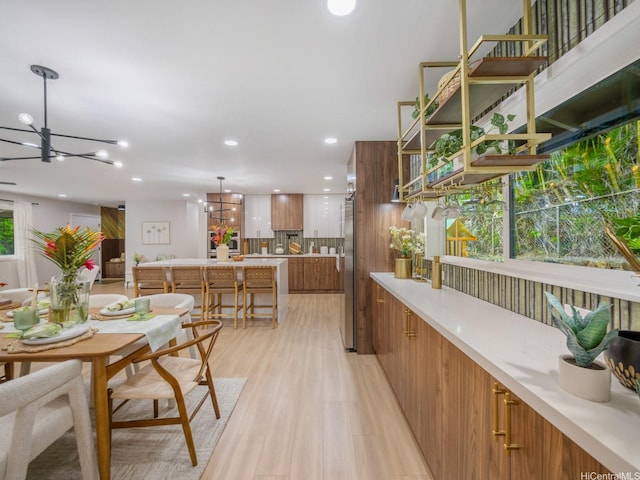 3641 Kumuone St, Honolulu, HI 96822 - dining space featuring a chandelier, light wood-style floors, and recessed lighting