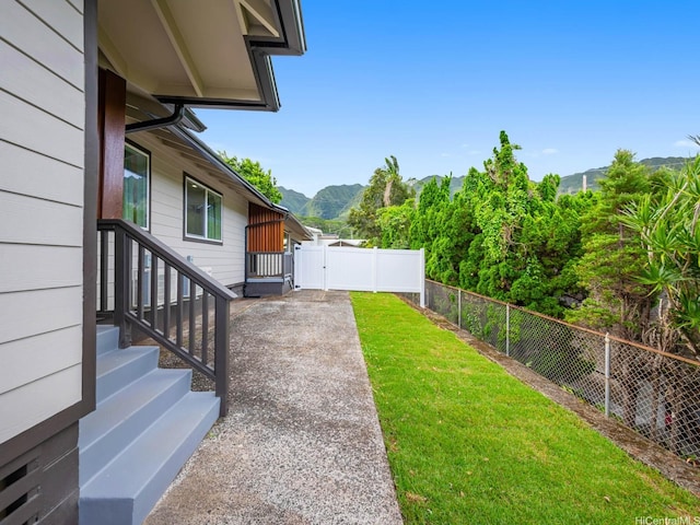 3641 Kumuone St, Honolulu, HI 96822 - view of yard featuring a mountain view and a gate