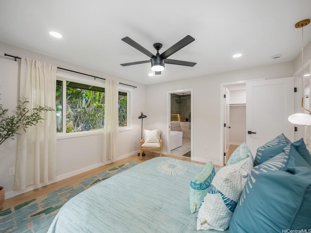 3641 Kumuone St, Honolulu, HI 96822 - bedroom featuring a spacious closet, recessed lighting, wood finished floors, ensuite bath, and ceiling fan