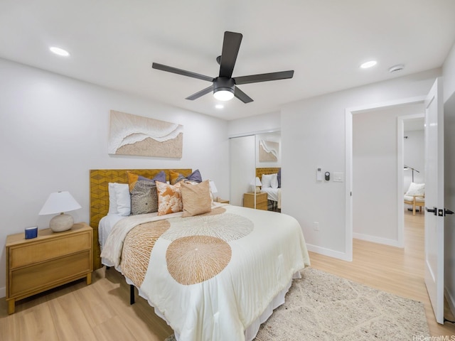 3641 Kumuone St, Honolulu, HI 96822 - bedroom with light wood-style flooring, recessed lighting, ceiling fan, and a closet