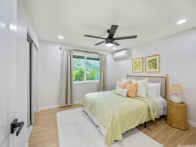 3641 Kumuone St, Honolulu, HI 96822 - bedroom featuring an AC wall unit, light wood-type flooring, recessed lighting, a closet, and ceiling fan