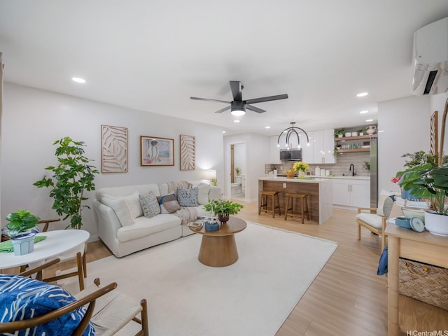3641 Kumuone St, Honolulu, HI 96822 - living area with a ceiling fan, recessed lighting, light wood finished floors, and a wall mounted AC