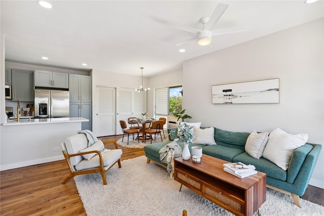 91-985 Puahala St Unit 42R, Ewa Beach, HI 96706 - living room featuring a chandelier, recessed lighting, wood finished floors, and ceiling fan