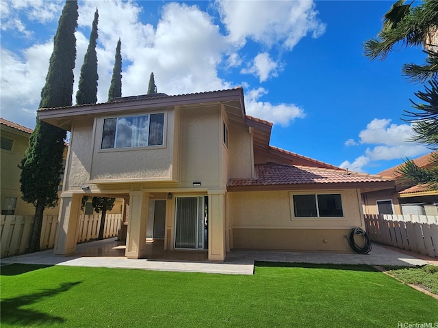 91-1040 Kanihaalilo St, Kapolei, HI 96707 - rear view of house with a tiled roof, a patio area, and stucco siding