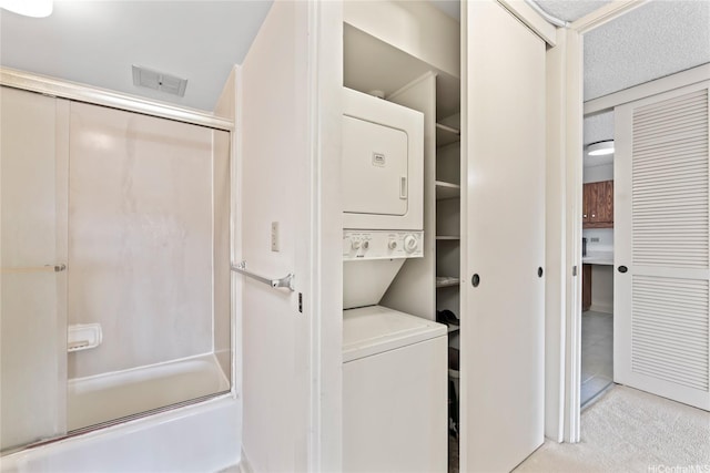 1717 Mott Smith Dr Unit 2212, Honolulu, HI 96822 - washroom featuring stacked washing machine and dryer