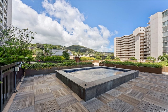 1717 Mott Smith Dr Unit 2212, Honolulu, HI 96822 - view of swimming pool featuring a hot tub and a mountain view