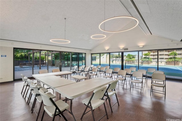 1717 Mott Smith Dr Unit 2212, Honolulu, HI 96822 - dining room featuring a textured ceiling, wood finished floors, and high vaulted ceiling