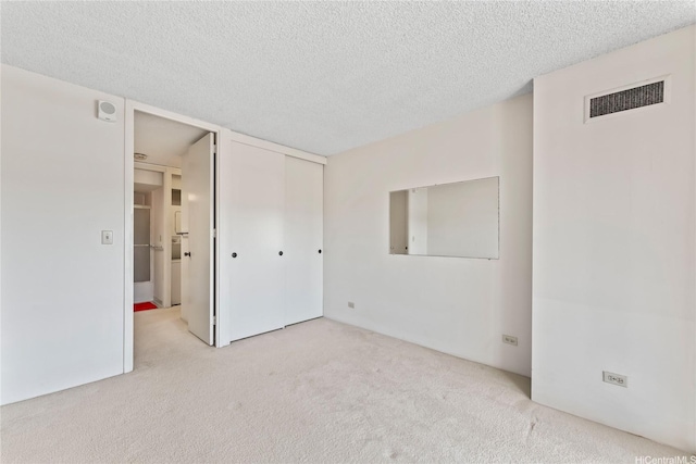 1717 Mott Smith Dr Unit 2212, Honolulu, HI 96822 - unfurnished bedroom featuring carpet floors, a textured ceiling, and a closet
