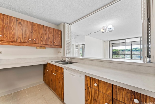1717 Mott Smith Dr Unit 2212, Honolulu, HI 96822 - kitchen featuring white dishwasher, brown cabinets, plenty of natural light, light countertops, and a textured ceiling