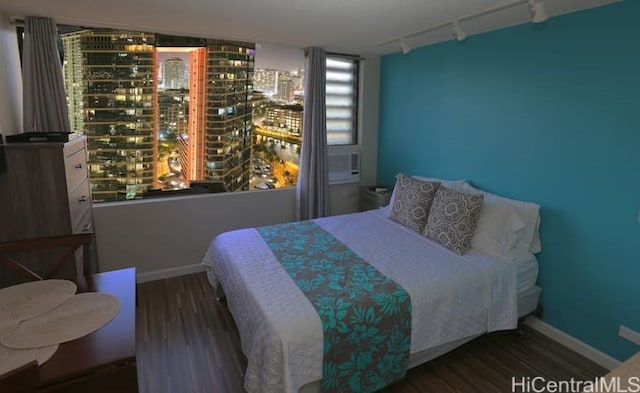 444 Niu St Unit 3608, Honolulu, HI 96815 - bedroom featuring track lighting and wood finished floors