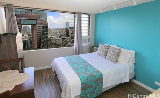 444 Niu St Unit 3608, Honolulu, HI 96815 - bedroom with track lighting, wood finished floors, and a view of city