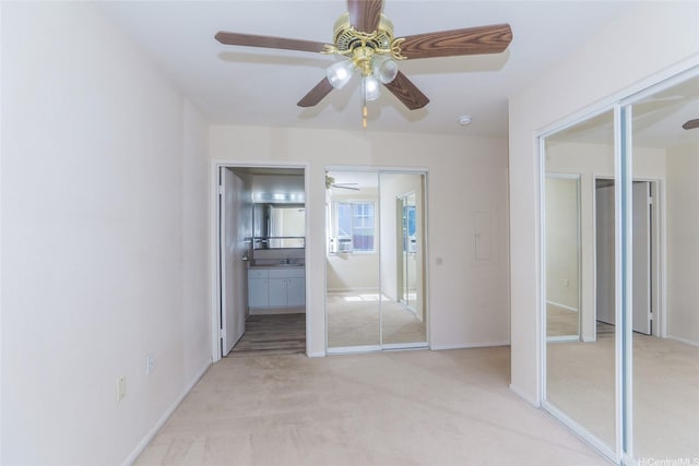 91-1093 Namahoe St Unit 5E, Kapolei, HI 96707 - unfurnished bedroom with light carpet, ensuite bath, and a ceiling fan