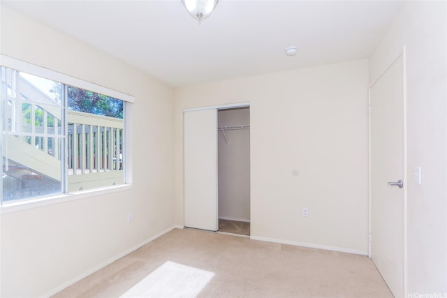 91-1093 Namahoe St Unit 5E, Kapolei, HI 96707 - unfurnished bedroom featuring light carpet and a closet