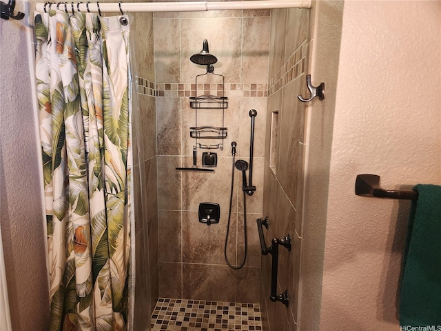94-373 Leleaka St, Mililani, HI 96789 - full bathroom featuring a tile shower and a textured wall