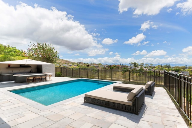 92-5056 Limukele St, Kapolei, HI 96707 - view of pool with a patio area and an outdoor kitchen